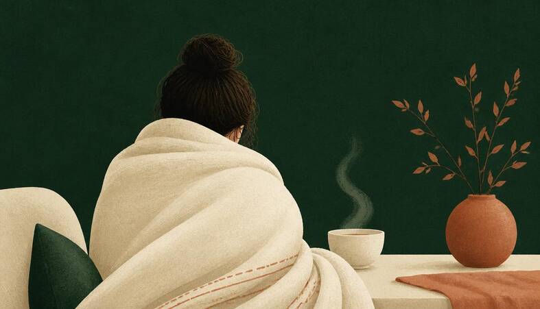 Illustration of a person wrapped in a blanket beside a steaming bowl